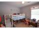 Playroom with a lofted bed and pink accents at 116 Remington Place Blvd, Dallas, GA 30157
