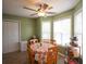 Bright eat-in kitchen with natural light, green walls, ceiling fan, and an inviting breakfast area at 116 Remington Place Blvd, Dallas, GA 30157