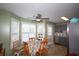 Eat-in kitchen with stainless steel appliances, gray cabinets and a breakfast nook with lots of light from surrounding windows at 116 Remington Place Blvd, Dallas, GA 30157