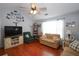 Spacious living room featuring hardwood floors, lots of light, and neutral paint at 116 Remington Place Blvd, Dallas, GA 30157