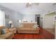 Comfortable living room features hardwood floors, neutral walls, lots of light and a half wall to separate the space at 116 Remington Place Blvd, Dallas, GA 30157