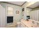 Bathroom featuring a single vanity, large mirror, toilet, and shower with a curtain at 2261 Ravenwood Trl, Marietta, GA 30066