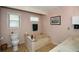 Bathroom featuring a toilet and combination tub/shower with white fixtures at 2261 Ravenwood Trl, Marietta, GA 30066