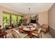Charming dining area with chandelier lighting, a round table and bay window at 2261 Ravenwood Trl, Marietta, GA 30066