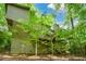 Unique angle of house exterior with multi-level decks surrounded by mature trees at 2261 Ravenwood Trl, Marietta, GA 30066