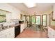 Kitchen features white cabinetry, wood countertops and a breakfast nook with verdant views at 2261 Ravenwood Trl, Marietta, GA 30066