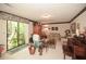 Cozy living room area with sliding glass door to the outside and carpeted flooring at 2261 Ravenwood Trl, Marietta, GA 30066