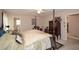 Bright main bedroom with attached bath featuring neutral paint and ample natural light at 2261 Ravenwood Trl, Marietta, GA 30066