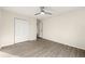 Neutral bedroom features light wood-look floors, ceiling fan and a closet at 2331 Luther St, Lithonia, GA 30058