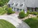 Overhead view of a beautiful brick home with a circular driveway and manicured landscaping at 275 Frances Rd, Canton, GA 30114