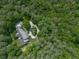 Stunning aerial view of a house surrounded by lush, mature trees, offering privacy and seclusion at 275 Frances Rd, Canton, GA 30114