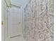 Bathroom detail showcasing a decorative shower curtain and white door at 275 Frances Rd, Canton, GA 30114