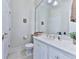 Bright bathroom featuring a single sink vanity, neutral paint and hardware, and a large mirror at 275 Frances Rd, Canton, GA 30114