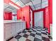 Bathroom showcases a modern white vanity, tiled floors, and vibrant red walls at 275 Frances Rd, Canton, GA 30114
