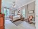 Bedroom with plush carpet, neutral walls, rocking chair and a vintage chest of drawers at 275 Frances Rd, Canton, GA 30114