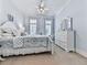 Calming bedroom with neutral walls, plush carpet, white furniture and crown molding at 275 Frances Rd, Canton, GA 30114