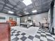Unique bedroom boasts stylish tin ceiling, checkerboard floor, and ample space for work and relaxation at 275 Frances Rd, Canton, GA 30114