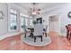 Bright breakfast nook featuring round table, hardwood floors, and natural light from large windows at 275 Frances Rd, Canton, GA 30114