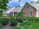 Beautiful two-story brick home with mature landscaping and lots of curb appeal on a sunny day at 275 Frances Rd, Canton, GA 30114