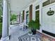 Inviting front porch with a rocking chair, porch swing, and decorative welcome sign at 275 Frances Rd, Canton, GA 30114