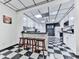 Charming kitchen area with black countertops, white cabinets, and convenient breakfast bar seating at 275 Frances Rd, Canton, GA 30114