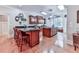 Spacious kitchen with wooden cabinets, granite countertops, an island with seating and a cozy breakfast nook at 275 Frances Rd, Canton, GA 30114