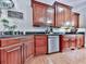 Close up of the kitchen with wooden cabinets, granite countertops, and stainless steel appliances at 275 Frances Rd, Canton, GA 30114