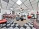 Spacious living area with checkered flooring, cozy fireplace, and built-in bookshelves, perfect for relaxation at 275 Frances Rd, Canton, GA 30114