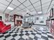Inviting living room features fireplace, built-in bookcases, and unique black and white checkered flooring at 275 Frances Rd, Canton, GA 30114