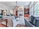 Bright living room with fireplace, hardwood floors, and large windows provides a comfortable and inviting space at 275 Frances Rd, Canton, GA 30114