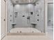 Oversized glass enclosed shower with a dual shower head, tiled walls, and built in shelves at 275 Frances Rd, Canton, GA 30114
