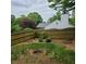 Backyard has wooden fence with landscaping near the house at 5859 Bellingrath Way, Lithonia, GA 30058