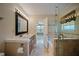 Bathroom featuring double sink vanity, glass enclosed shower, and separate tub at 5859 Bellingrath Way, Lithonia, GA 30058
