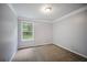 Comfortable bedroom with carpet and window view of trees at 5859 Bellingrath Way, Lithonia, GA 30058
