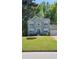 Charming two-story home with manicured lawn, neat landscaping, and attached garage at 5859 Bellingrath Way, Lithonia, GA 30058
