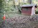 Overgrown backyard with a shed and heavy leaf litter at 637 Ferris St, Atlanta, GA 30310
