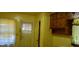 Kitchen area featuring cabinets, a window and a door leading outside at 637 Ferris St, Atlanta, GA 30310