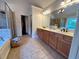 Bathroom featuring double sinks, bathtub, and a shower at 842 Treeline Dr, Conyers, GA 30016