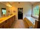 Bathroom featuring double sinks, bathtub, and a shower at 842 Treeline Dr, Conyers, GA 30016