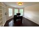 Bedroom featuring a modern desk, custom closet and bay windows at 842 Treeline Dr, Conyers, GA 30016