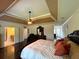 Spacious bedroom with dark wood floors and attached bathroom at 842 Treeline Dr, Conyers, GA 30016
