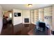 Spacious bedroom with fireplace, large closet, desk and dark wood floors at 842 Treeline Dr, Conyers, GA 30016