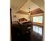 Bedroom with a massage chair, tray ceiling, fan, and dark wood floors at 842 Treeline Dr, Conyers, GA 30016
