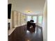 Bedroom featuring a modern desk, custom closet and dark wood floors at 842 Treeline Dr, Conyers, GA 30016