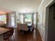 Bright dining area with a large window view, stylish furnishings and hardwood floors at 842 Treeline Dr, Conyers, GA 30016