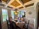 Dining room with coffered ceiling, and stylish chandelier at 842 Treeline Dr, Conyers, GA 30016