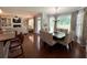 Dining area with seating for eight people, chandelier, and hardwood flooring at 842 Treeline Dr, Conyers, GA 30016