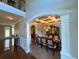 Elegant dining room boasts coffered ceiling and seamless entry from the main hall at 842 Treeline Dr, Conyers, GA 30016
