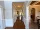 Hallway with hardwood floors and decorative molding at 842 Treeline Dr, Conyers, GA 30016