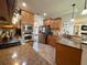 Kitchen with granite countertops, stainless appliances, and attached breakfast bar at 842 Treeline Dr, Conyers, GA 30016